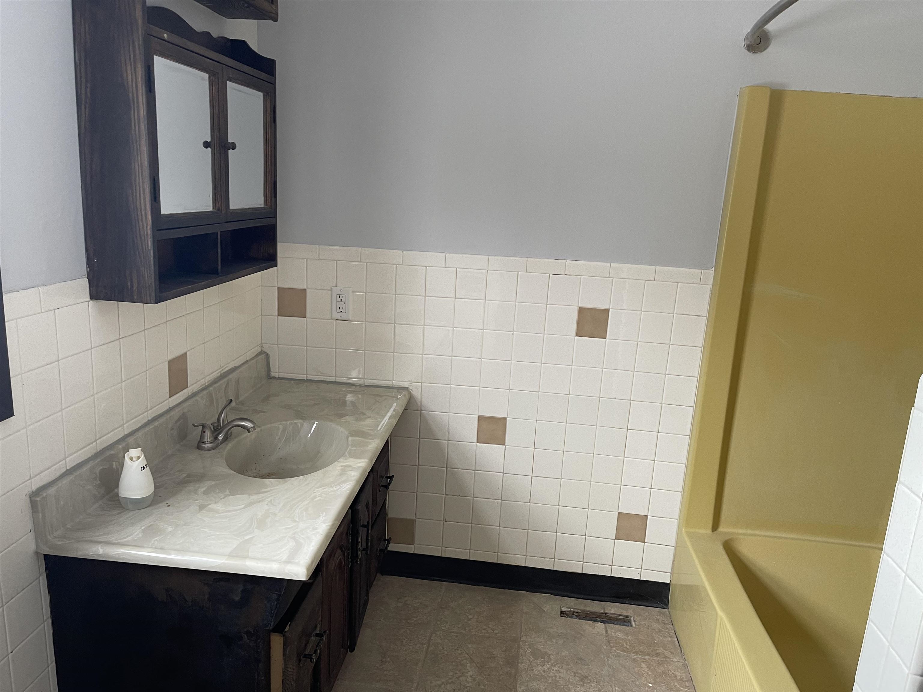 7870 Freeport Road Rockton, IL 61072 - Photo 12 of 22 a bathroom with a granite countertop sink and a mirror