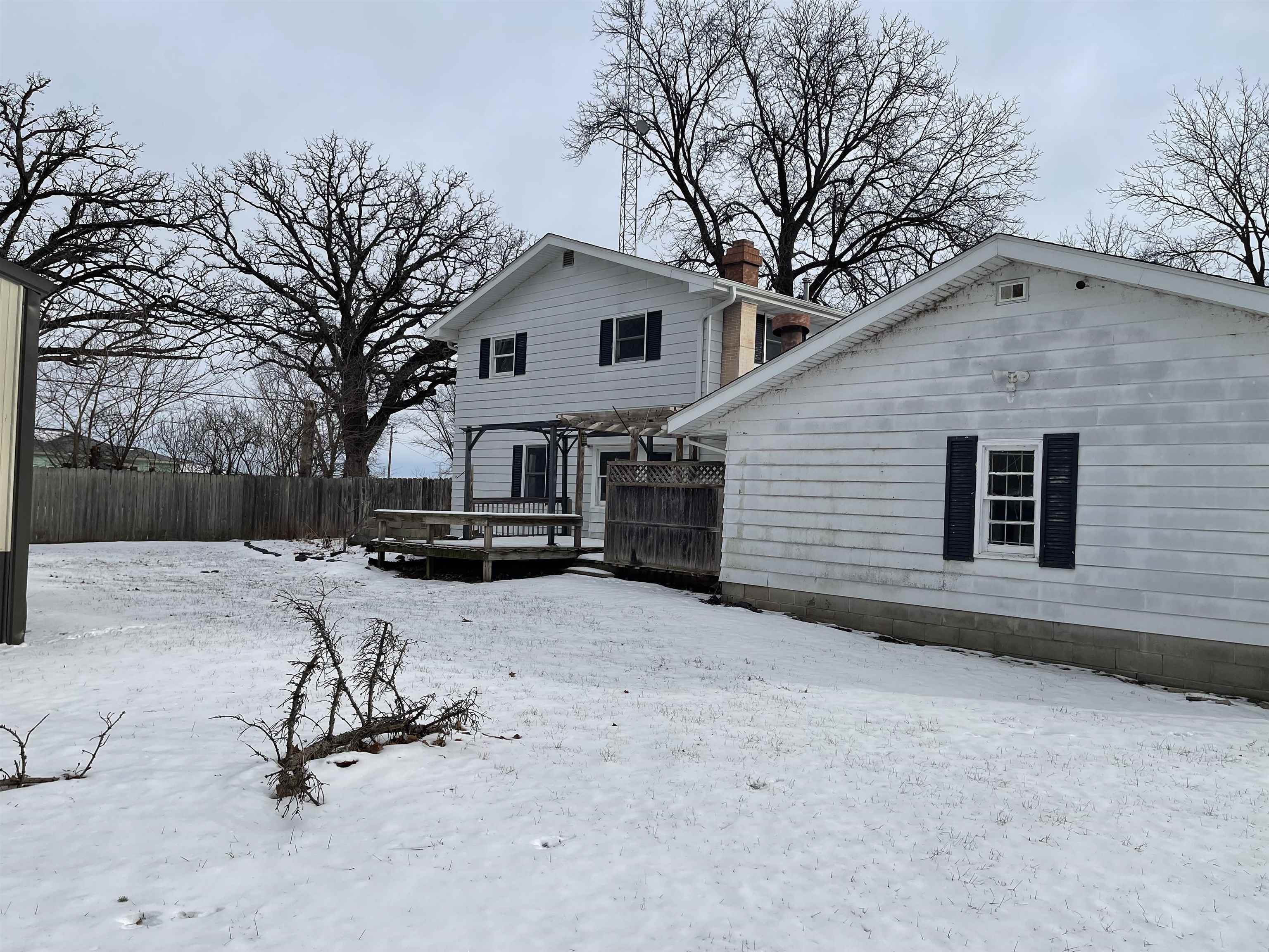 7870 Freeport Road Rockton, IL 61072 - Photo 22 of 22 a view of a house with a yard covered in snow