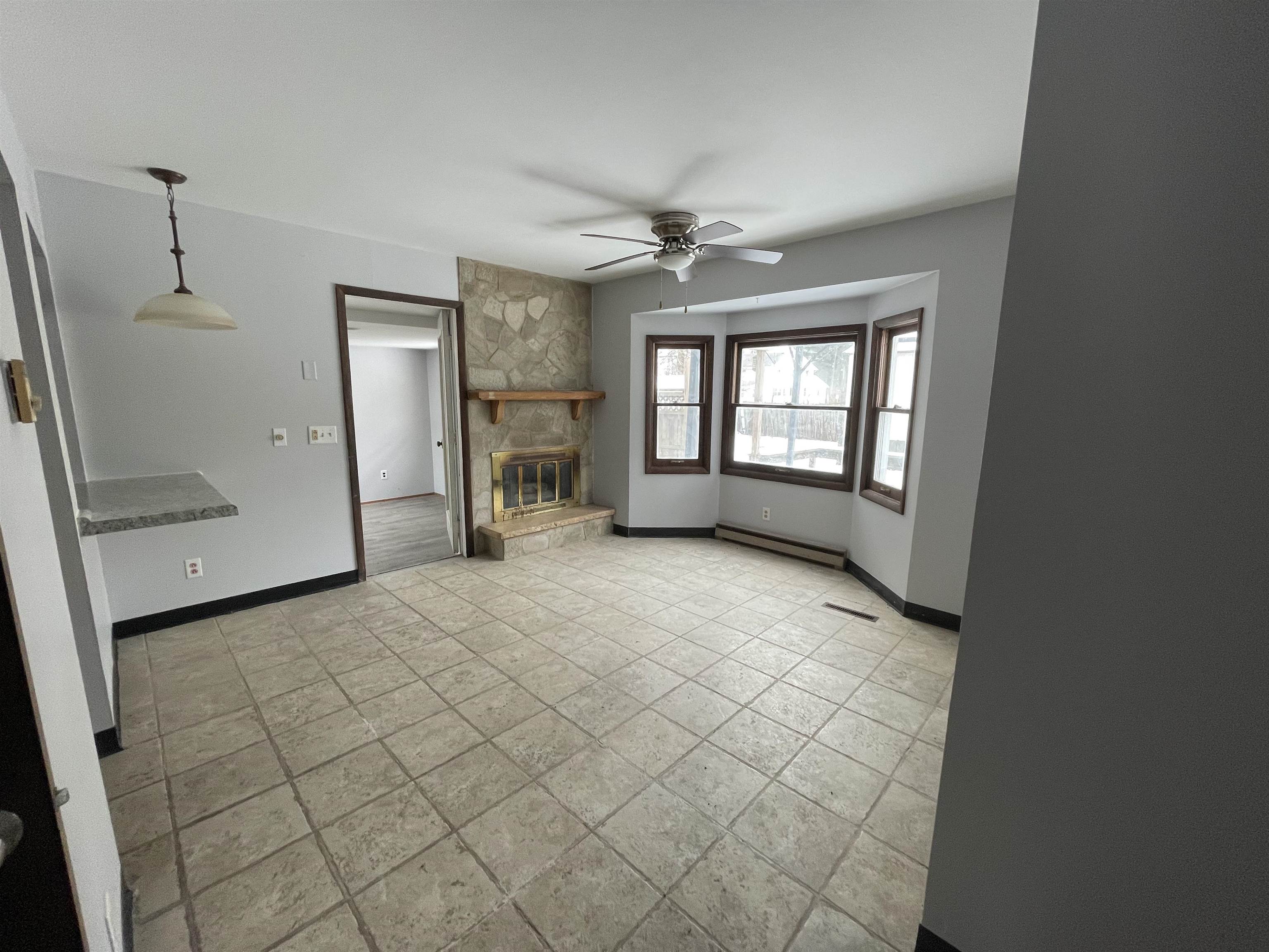 7870 Freeport Road Rockton, IL 61072 - Photo 6 of 22 wooden floor in an empty room with a window