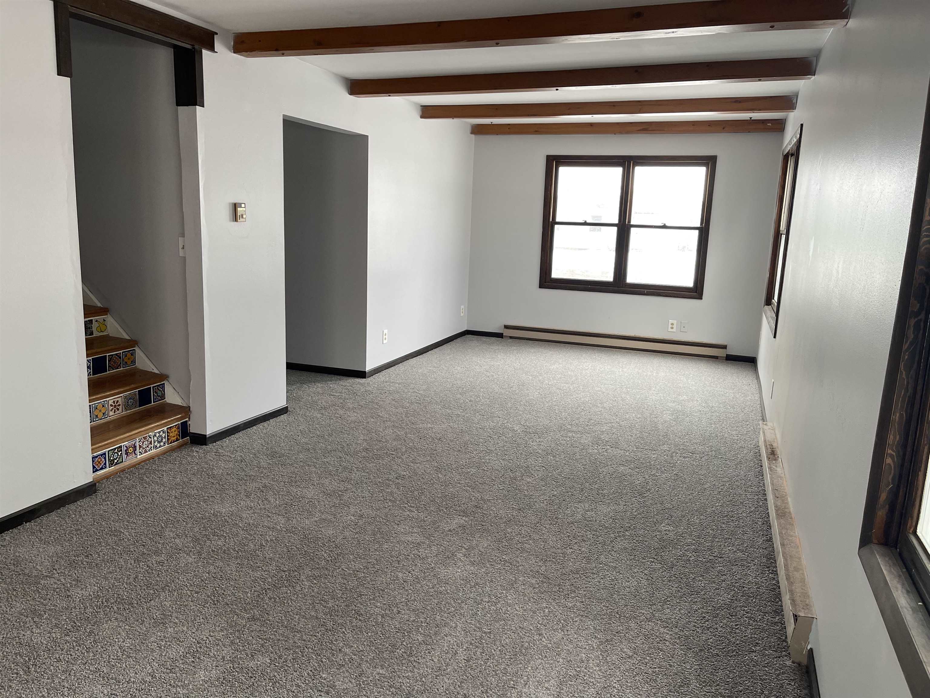 7870 Freeport Road Rockton, IL 61072 - Photo 10 of 22 a view of an empty room with a fireplace and a window