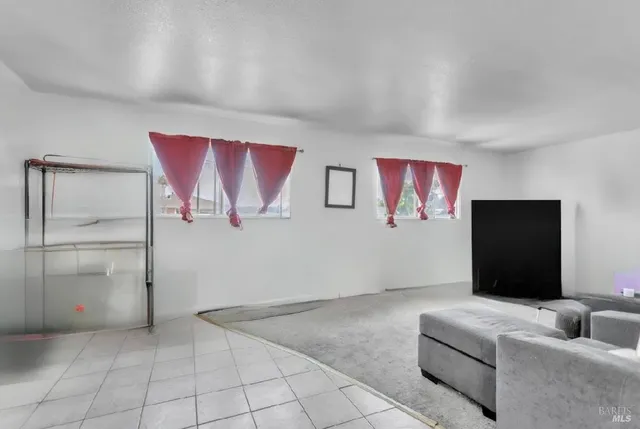 a view of a room with furniture and a bathroom