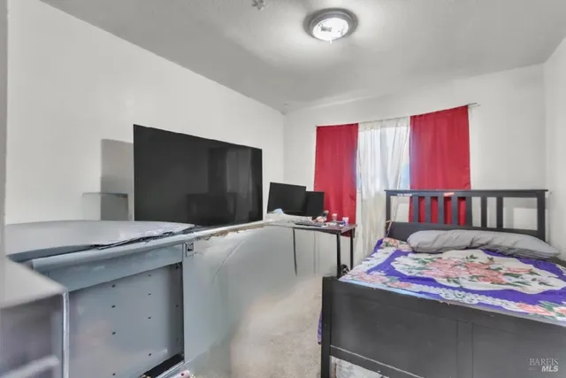 a white toilet sitting next to a bathroom sink