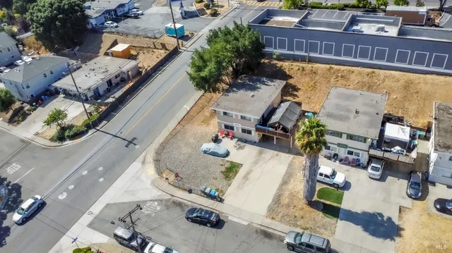 an aerial view of a house with outdoor space