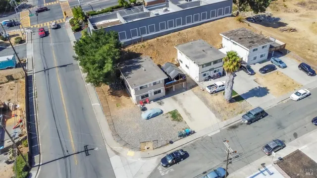 an aerial view of residential houses with outdoor space