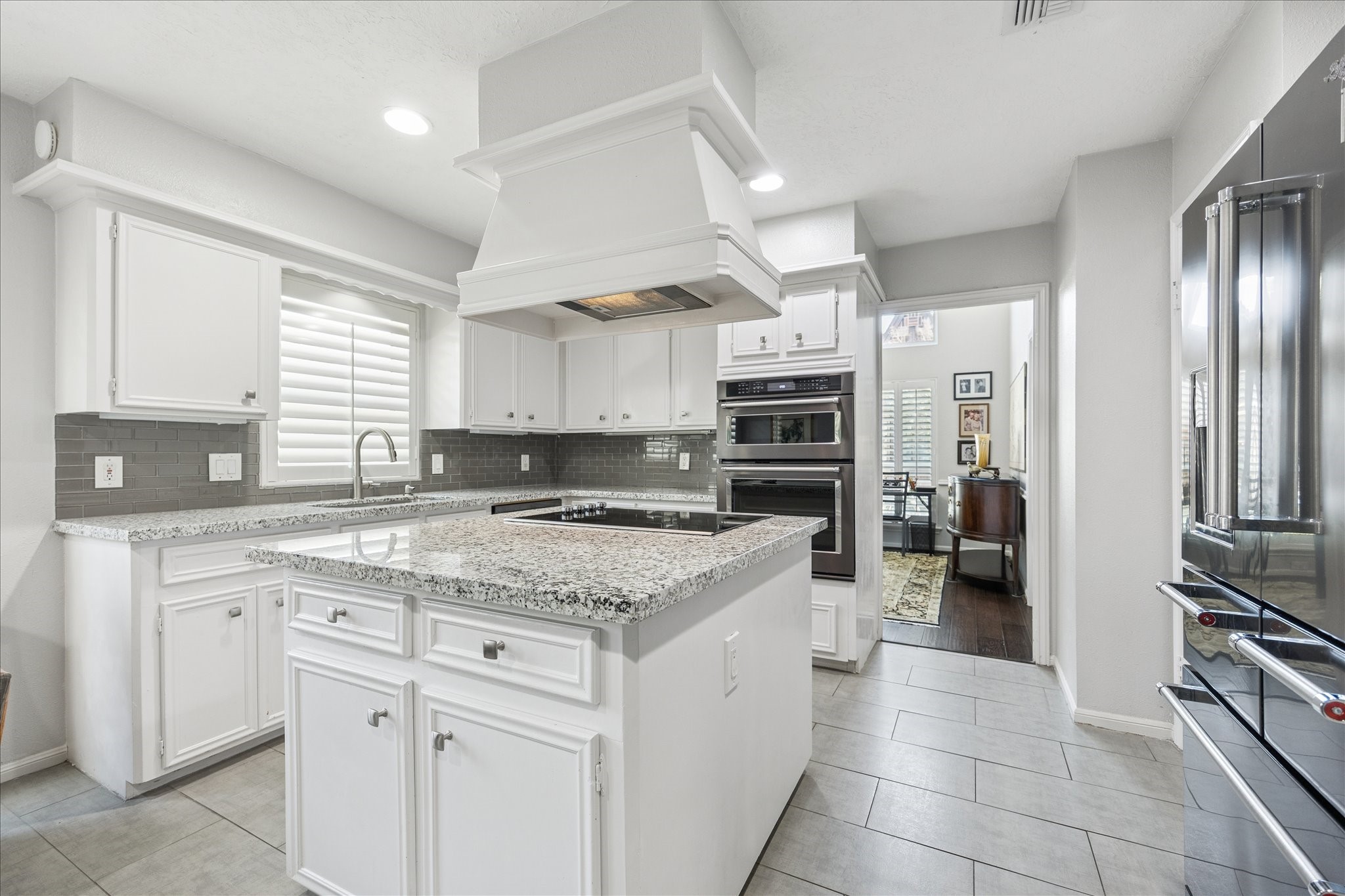 2930 Teague Road Houston, TX 77080 - Photo 10 of 22 a kitchen with a sink stove and refrigerator