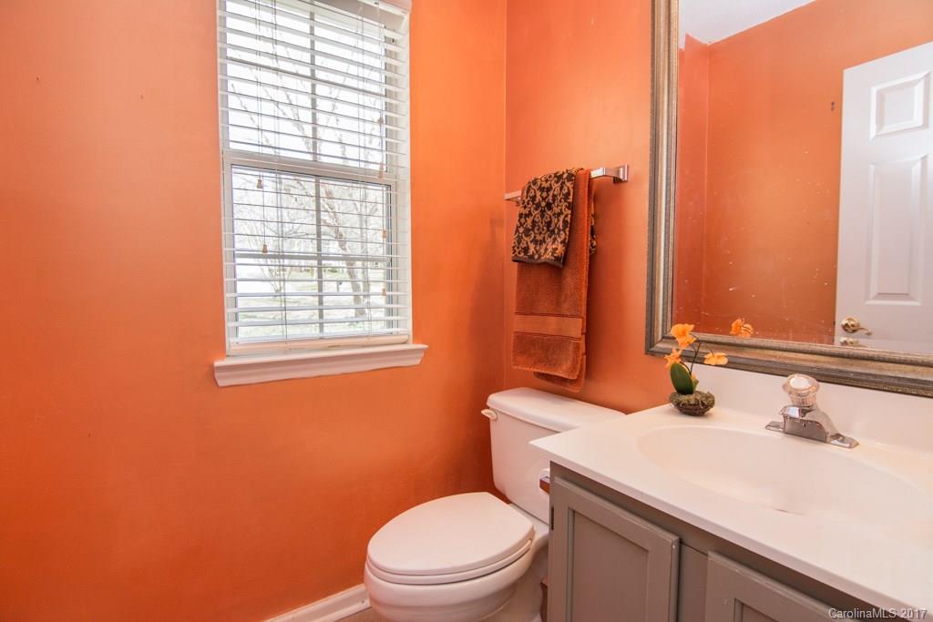 2901 Williams Station Road Matthews, NC 28105 - Photo 14 of 24 a bathroom with a sink a toilet and mirror