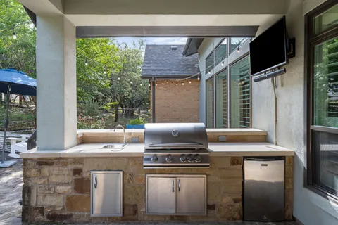 a kitchen with a stove and a refrigerator