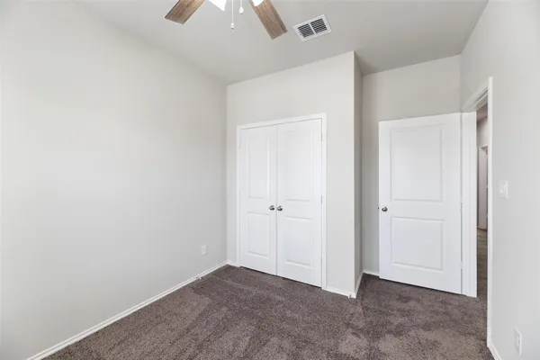 an empty room with a bathroom