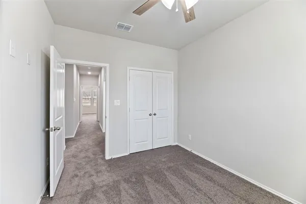 an empty room with a bathroom