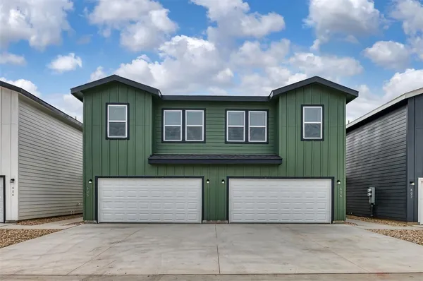 a front view of a house with yard