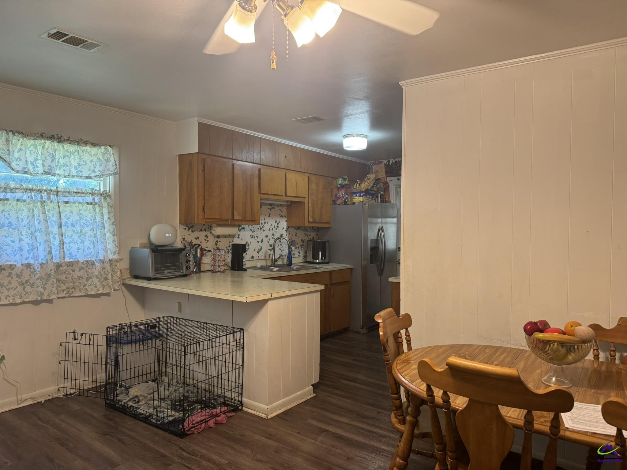1032 Elberta Road Warner Robins, GA 31093 - Photo 4 of 26 a kitchen with a table and chairs in it