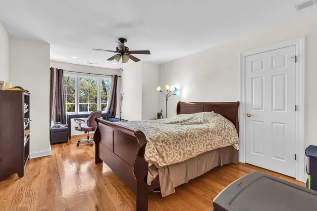 a bed room with a bed and a chandelier