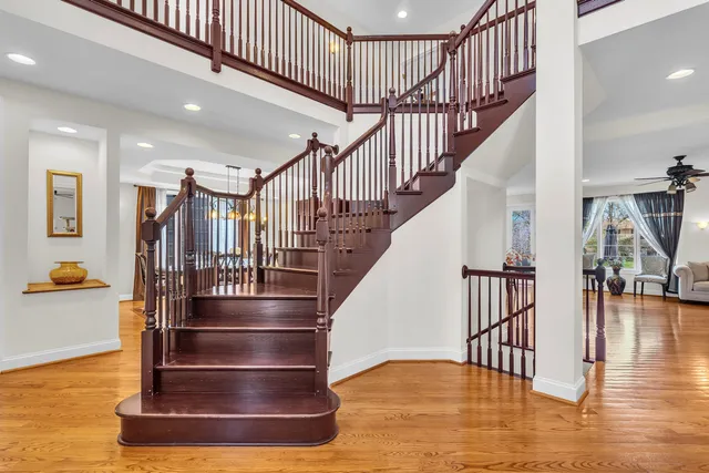 a view of entryway and hall with wooden floor