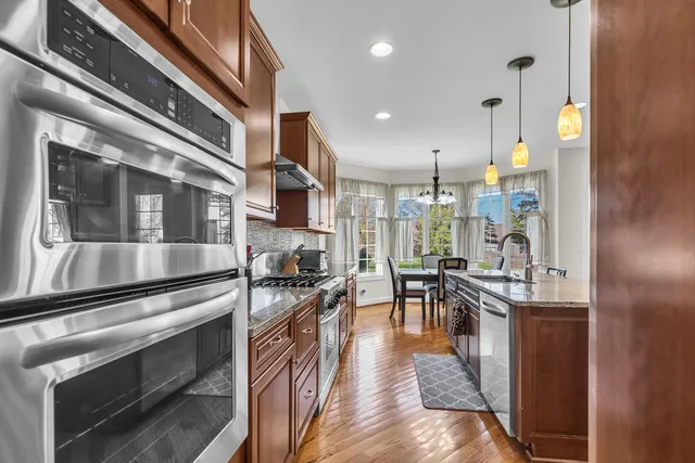 a kitchen with lots of counter top space and furniture