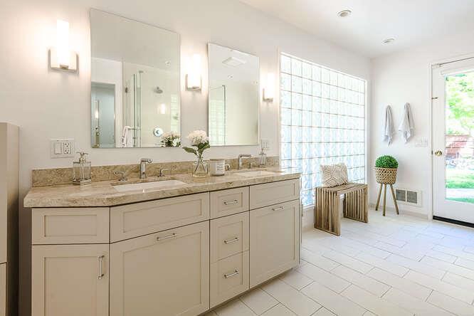 745 Bromfield Road Hillsborough, CA 94010 - Photo 23 of 42 a bathroom with a granite countertop sink and a bathtub