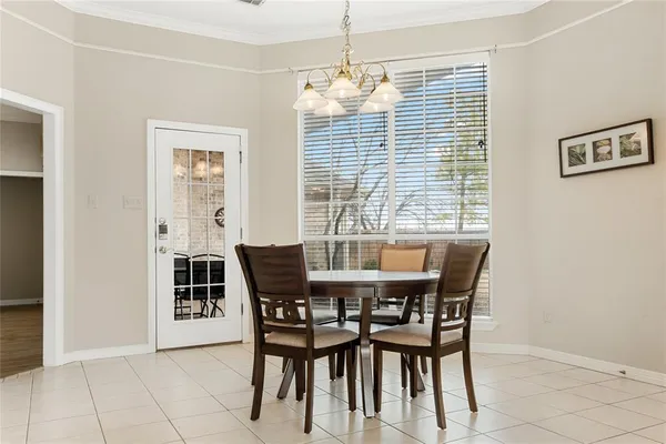 a view of a dining room with furniture and window