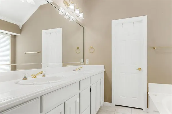 a bathroom with a sink a vanity and a mirror