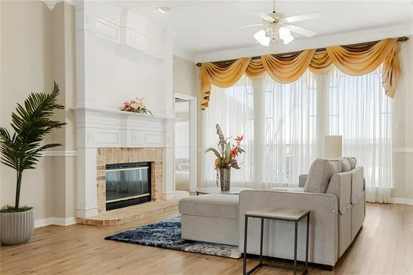 a living room with furniture fireplace and a fireplace