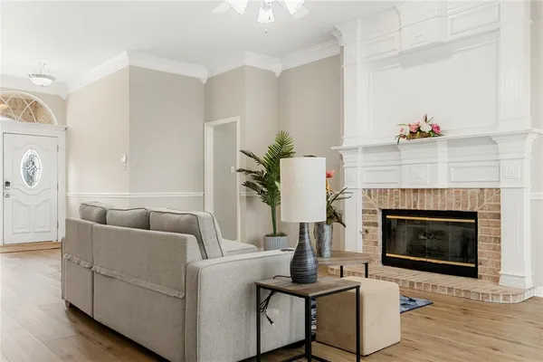 a living room with furniture and a fireplace