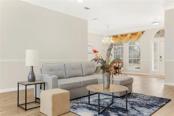 a living room with furniture and a large window