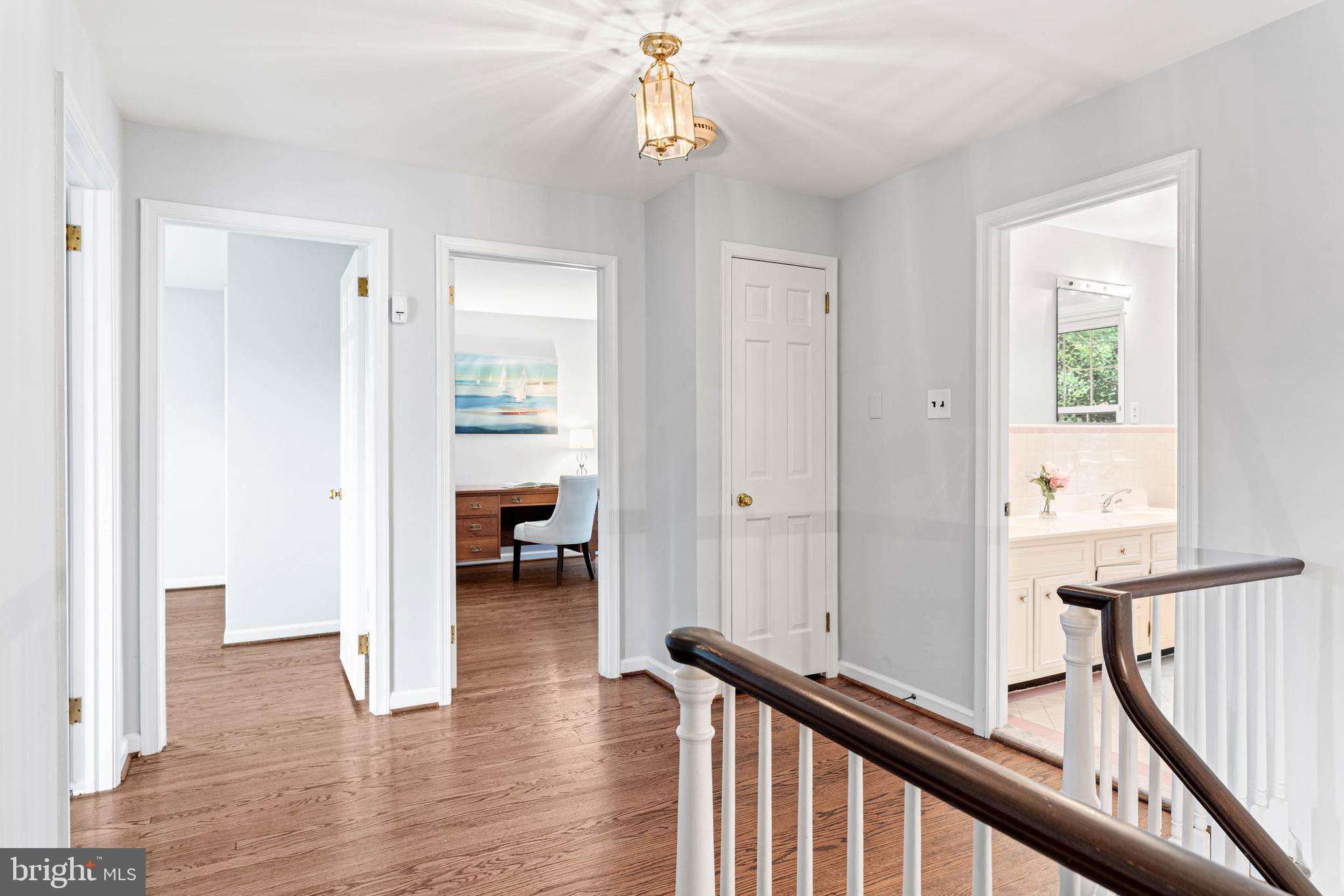533 Gulph Road Wayne, PA 19087 - Photo 20 of 43 a view of a hallway with wooden floor and staircase