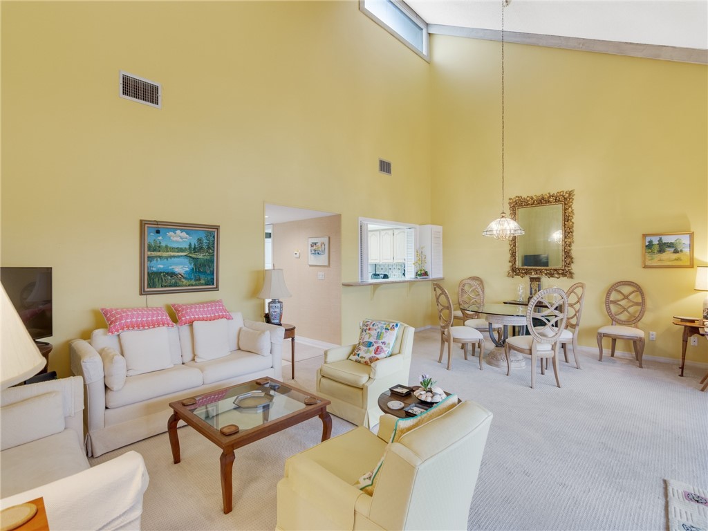 1880 Bay Road, Unit I319 Vero Beach, FL 32963 - Photo 5 of 36 a living room with furniture and wooden floor