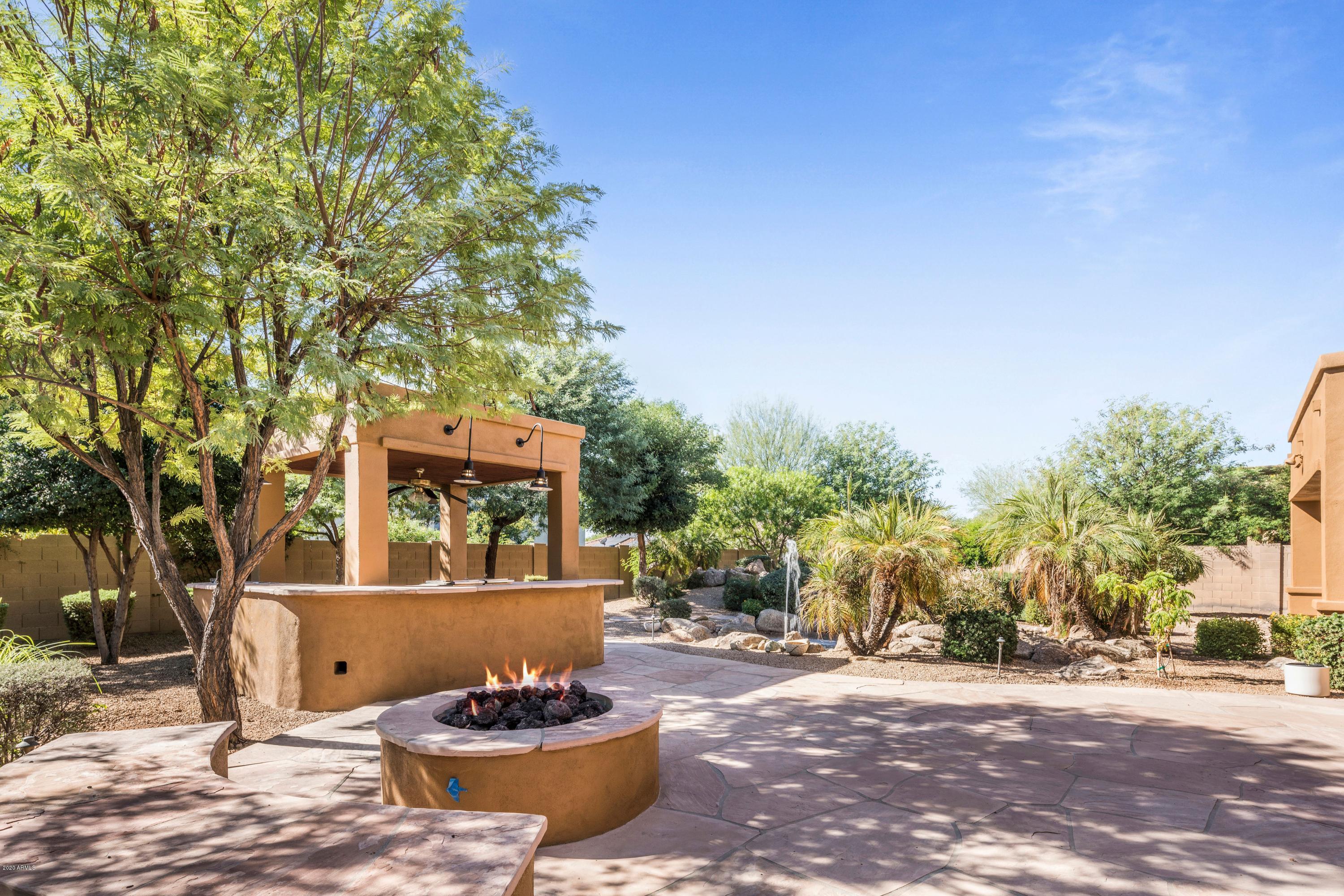 3735 East Maffeo Road Phoenix, AZ 85050 - Photo 9 of 16 Gas fire pit ~ Outdoor kitchen