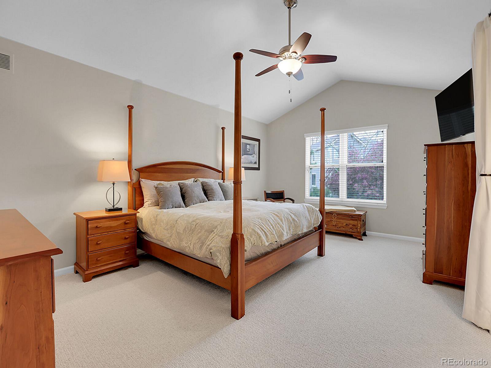 7138 Mountain Brush Circle Highlands Ranch, CO 80130 - Photo 22 of 50 a bedroom with a bed flat screen tv and window