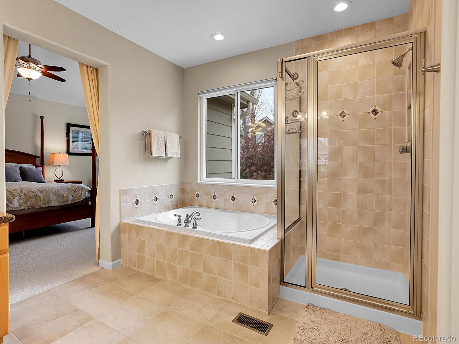 7138 Mountain Brush Circle Highlands Ranch, CO 80130 - Photo 25 of 50 a spacious bathroom with a tub shower and sink