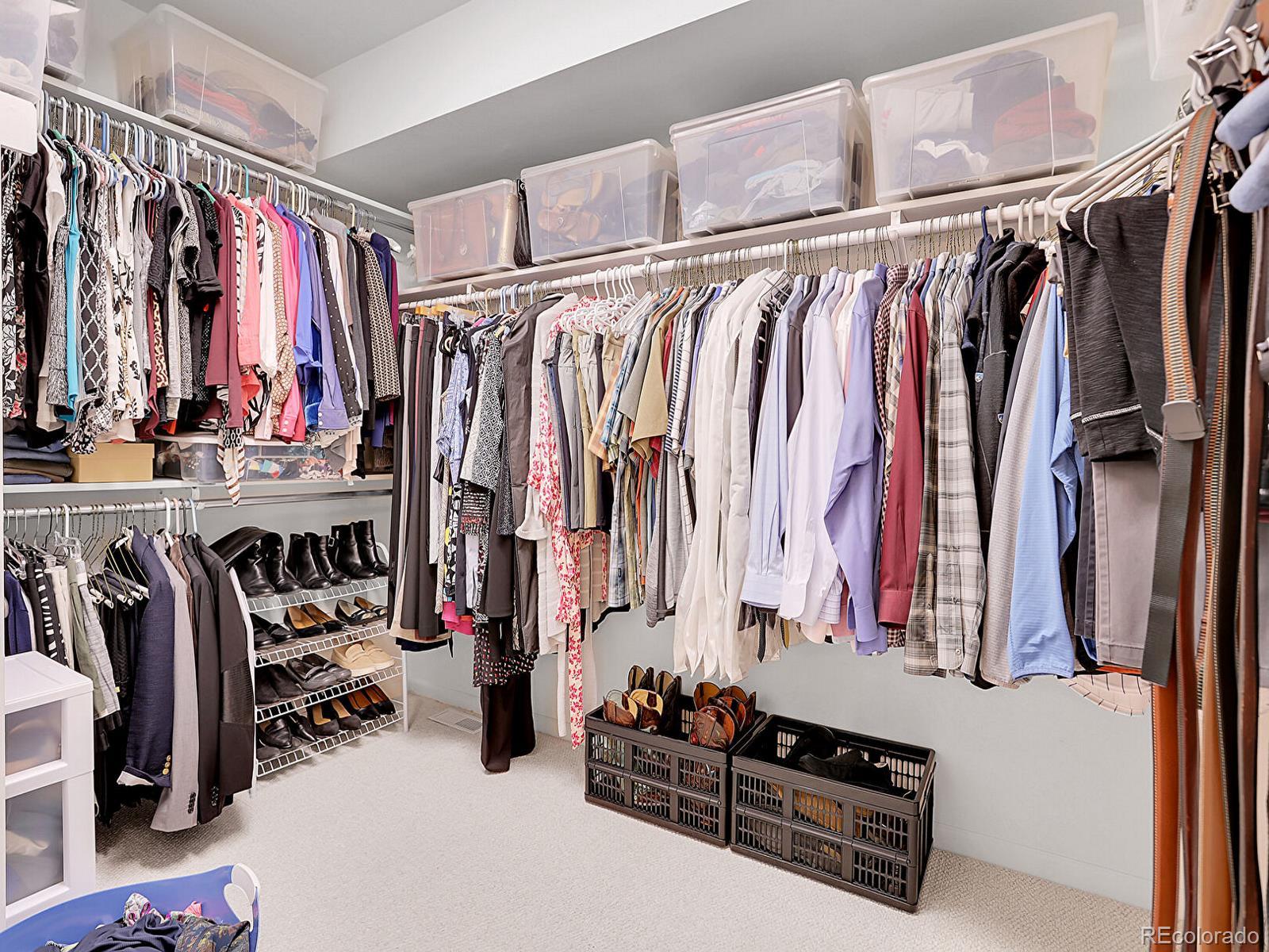 7138 Mountain Brush Circle Highlands Ranch, CO 80130 - Photo 27 of 50 a view of walk in closet with clothes and shoes