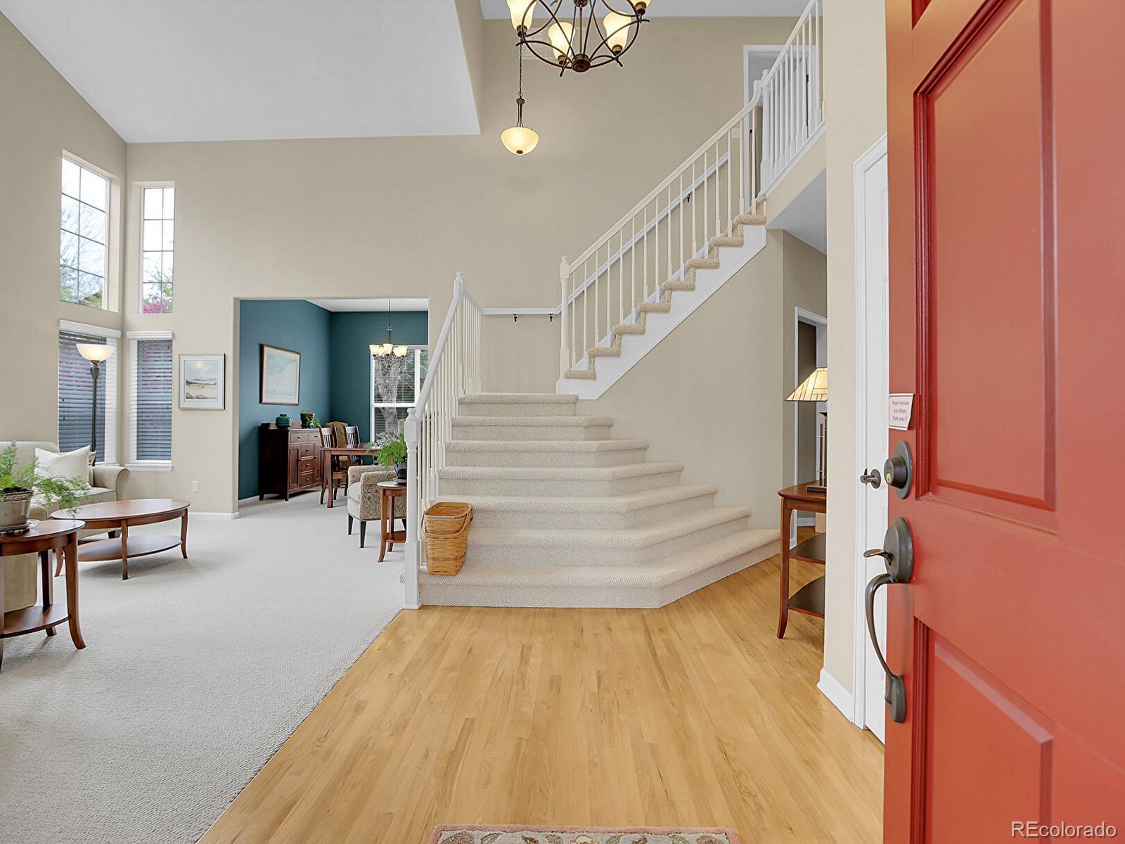 7138 Mountain Brush Circle Highlands Ranch, CO 80130 - Photo 3 of 50 a view of entryway and hall with wooden floor