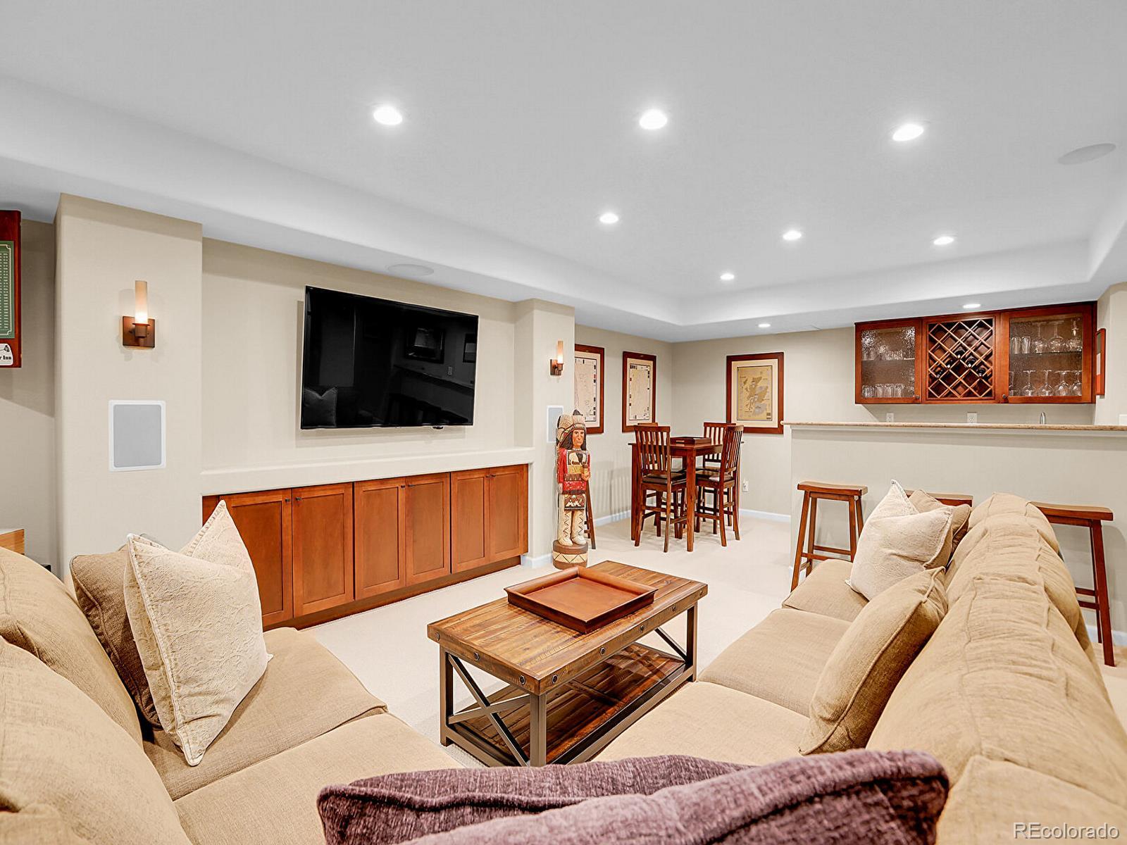 7138 Mountain Brush Circle Highlands Ranch, CO 80130 - Photo 36 of 50 a living room with furniture and a flat screen tv