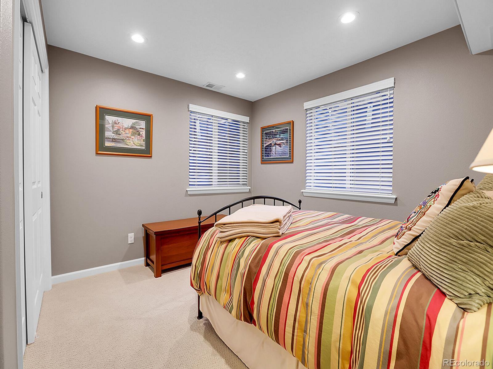 7138 Mountain Brush Circle Highlands Ranch, CO 80130 - Photo 39 of 50 a bedroom with bed and a window