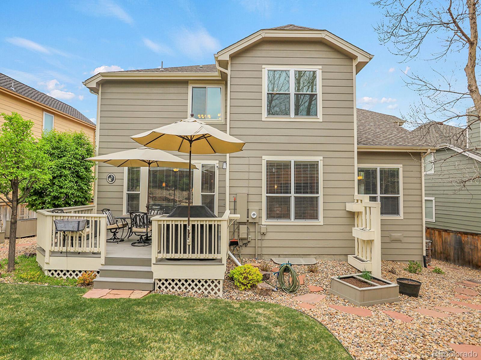 7138 Mountain Brush Circle Highlands Ranch, CO 80130 - Photo 46 of 50 a front view of a house with a yard