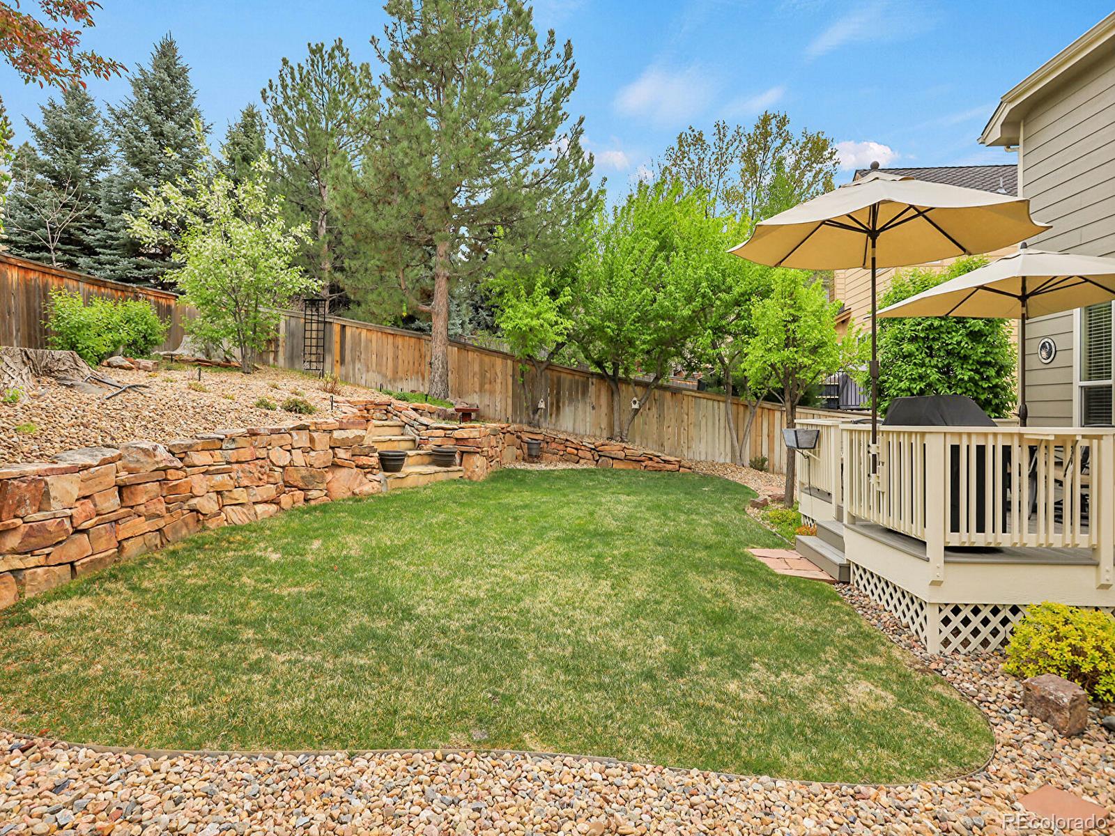 7138 Mountain Brush Circle Highlands Ranch, CO 80130 - Photo 47 of 50 a view of backyard with deck and garden