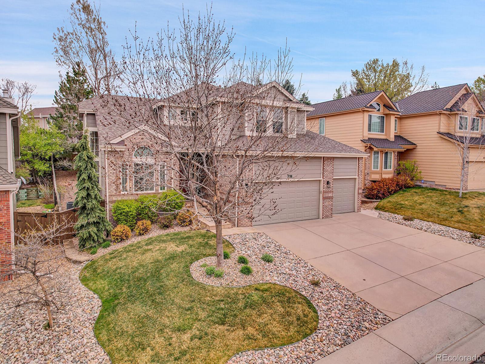 7138 Mountain Brush Circle Highlands Ranch, CO 80130 - Photo 49 of 50 front view of a house with a yard