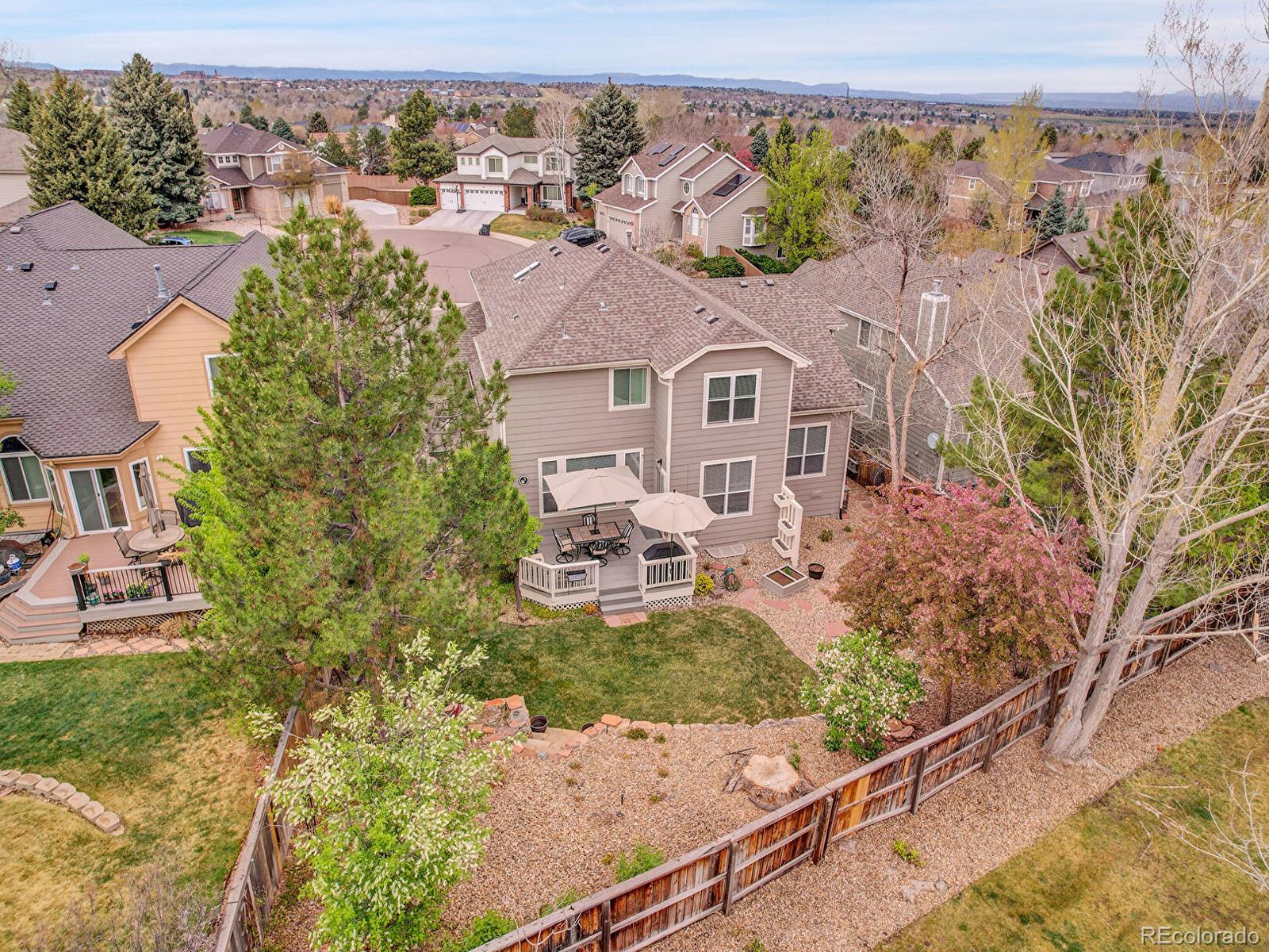 7138 Mountain Brush Circle Highlands Ranch, CO 80130 - Photo 50 of 50 an aerial view of a house with swimming pool and garden
