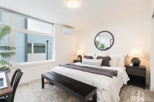 a bedroom with bed and a window