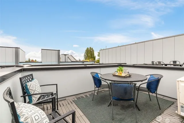 a view of a dining room with furniture and window