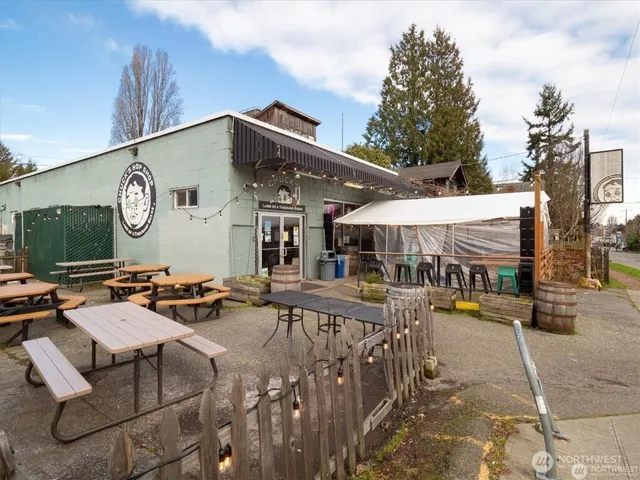 a view of swimming pool with an outdoor seating