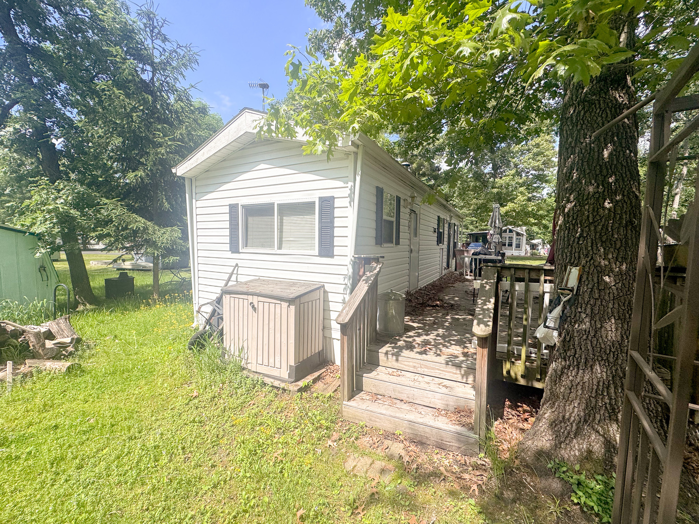 7-98 Woodhaven Sublette, IL 61367 - Photo 8 of 23 a front view of a house with a yard