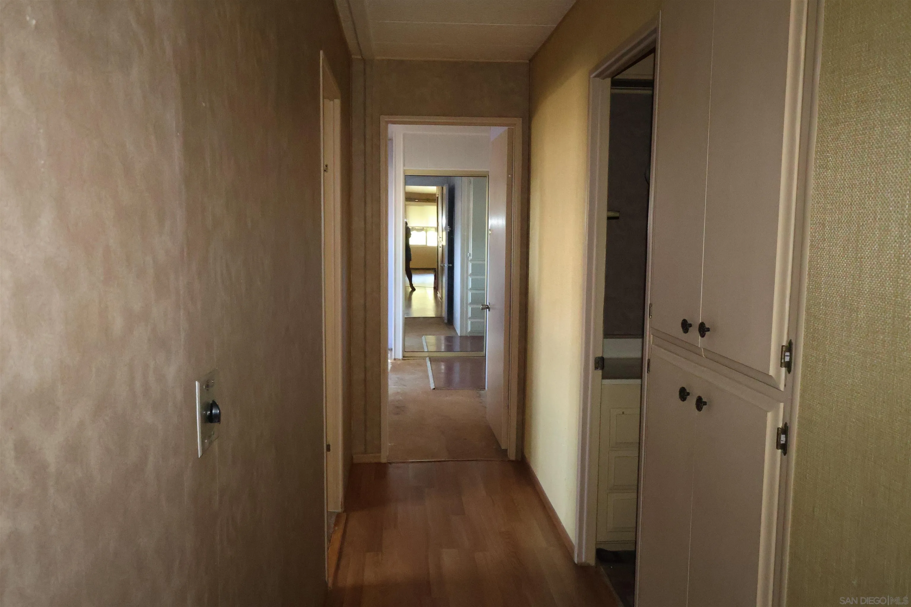 4747 Oak Crest Road, Unit 48 Fallbrook, CA 92028 - Photo 12 of 22 a view of a hallway with wooden floor