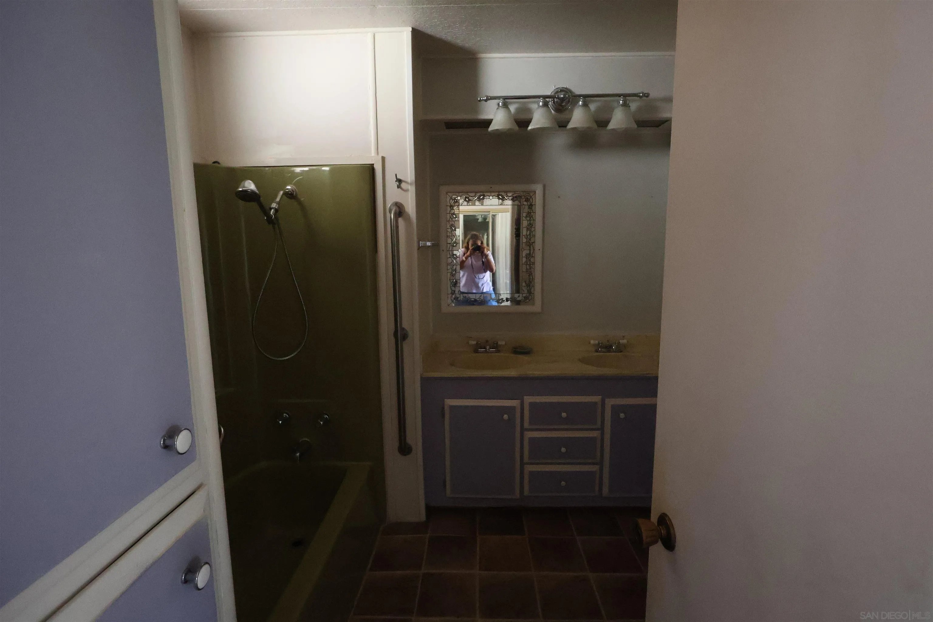 4747 Oak Crest Road, Unit 48 Fallbrook, CA 92028 - Photo 15 of 22 a bathroom with a mirror and a shower