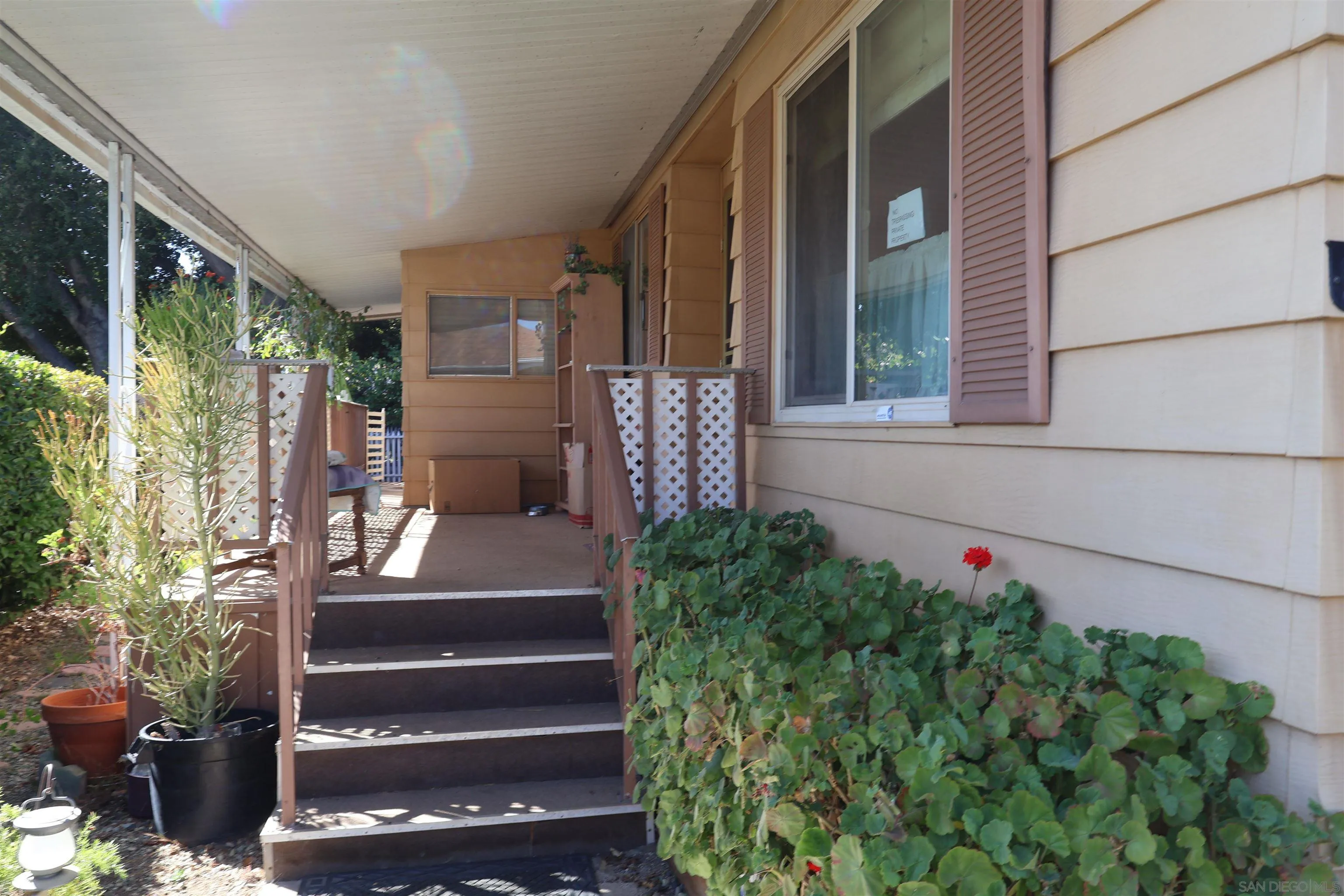 4747 Oak Crest Road, Unit 48 Fallbrook, CA 92028 - Photo 4 of 22 a view of front door with potted plants