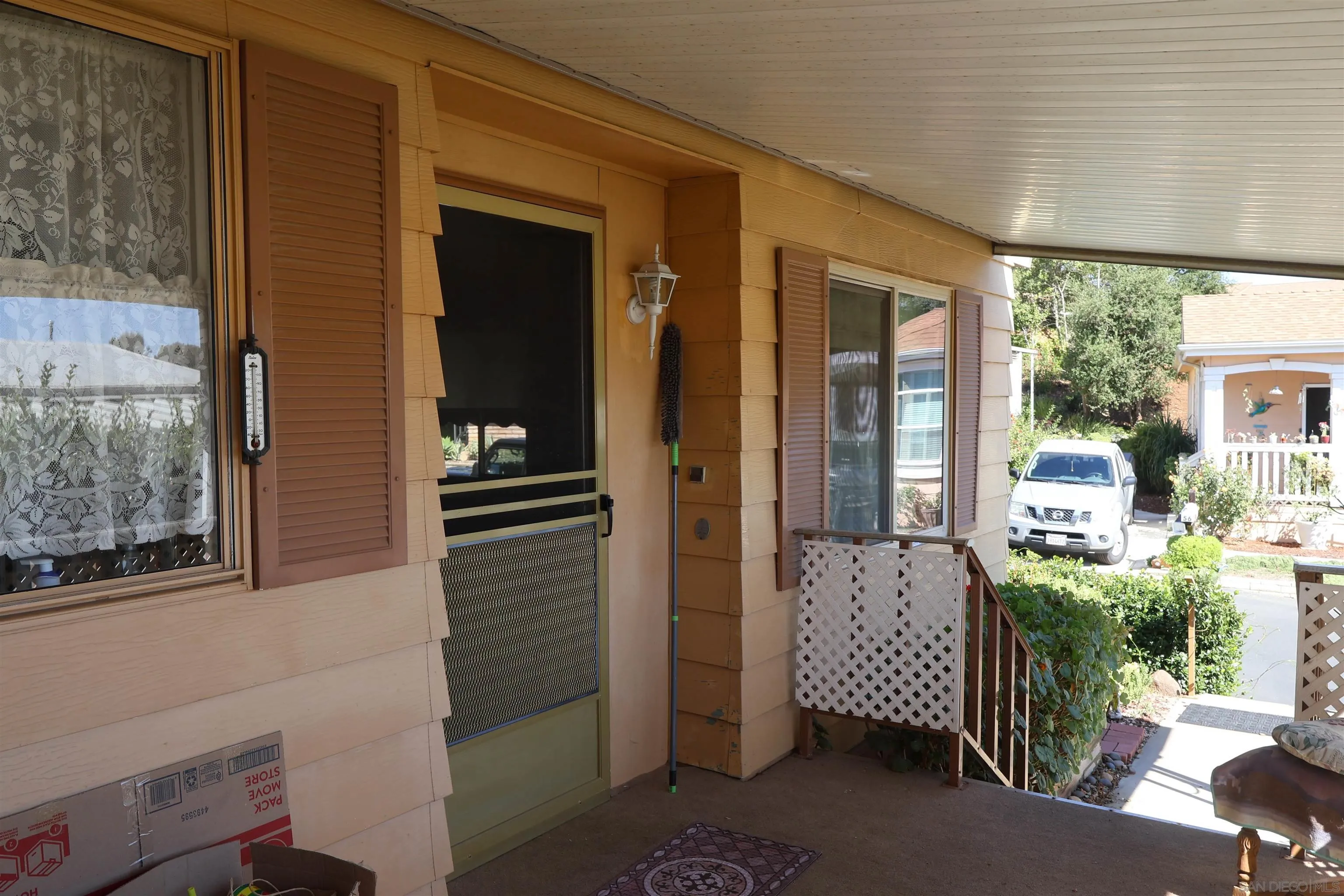 4747 Oak Crest Road, Unit 48 Fallbrook, CA 92028 - Photo 5 of 22 a view of a door and chair in the balcony