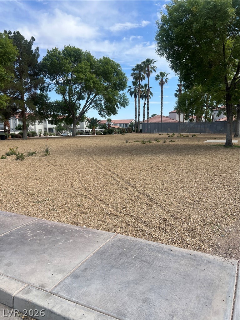 3318 North Decatur Boulevard, Unit 1174 Las Vegas, NV 89130 - Photo 19 of 23 This spacious lot offers prime development potential, surrounded by mature trees and lush landscaping.