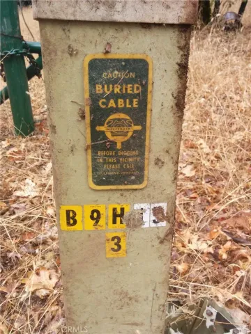 a sign board on a brick wall