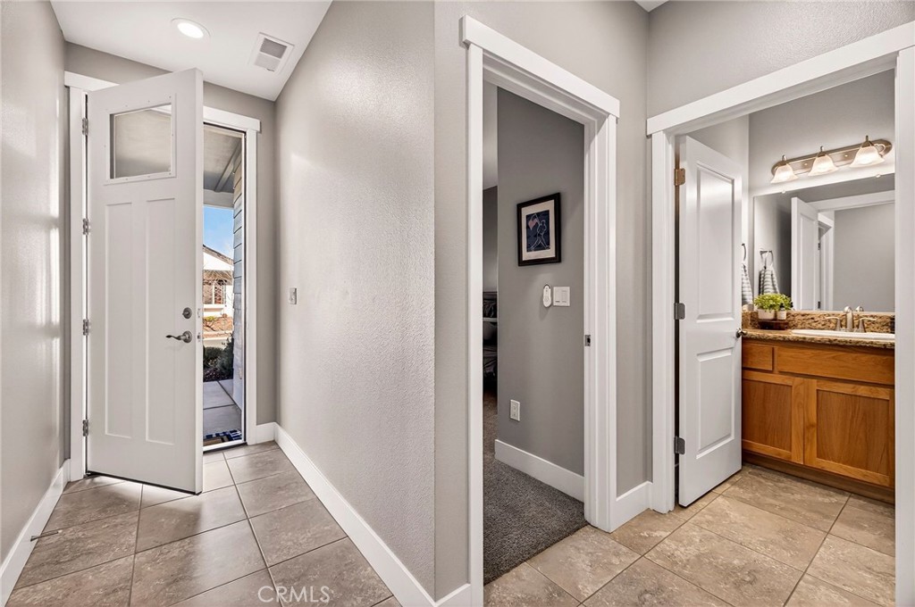 2855 Pin Oak Lane Chico, CA 95928 - Photo 11 of 48 a view of a hallway and an dining rom with furniture