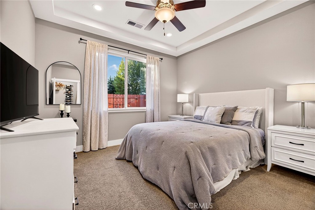 2855 Pin Oak Lane Chico, CA 95928 - Photo 16 of 48 a spacious bedroom with a bed and a large window
