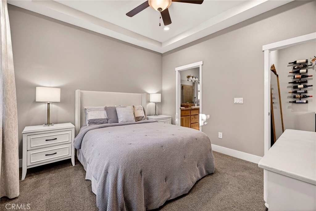 2855 Pin Oak Lane Chico, CA 95928 - Photo 17 of 48 a bedroom with a bed and a chandelier